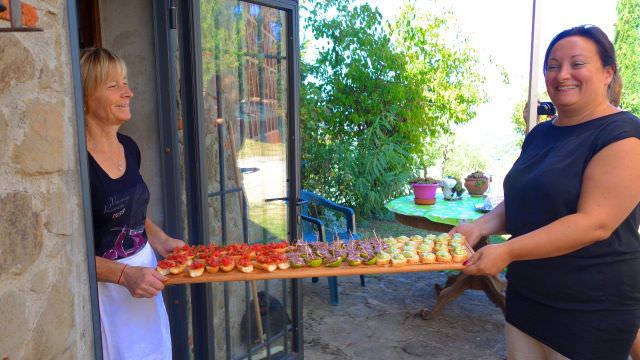 Two of our guests helping out with the antipasto before our incredible meal at a family-run winery near Greve in Chianti